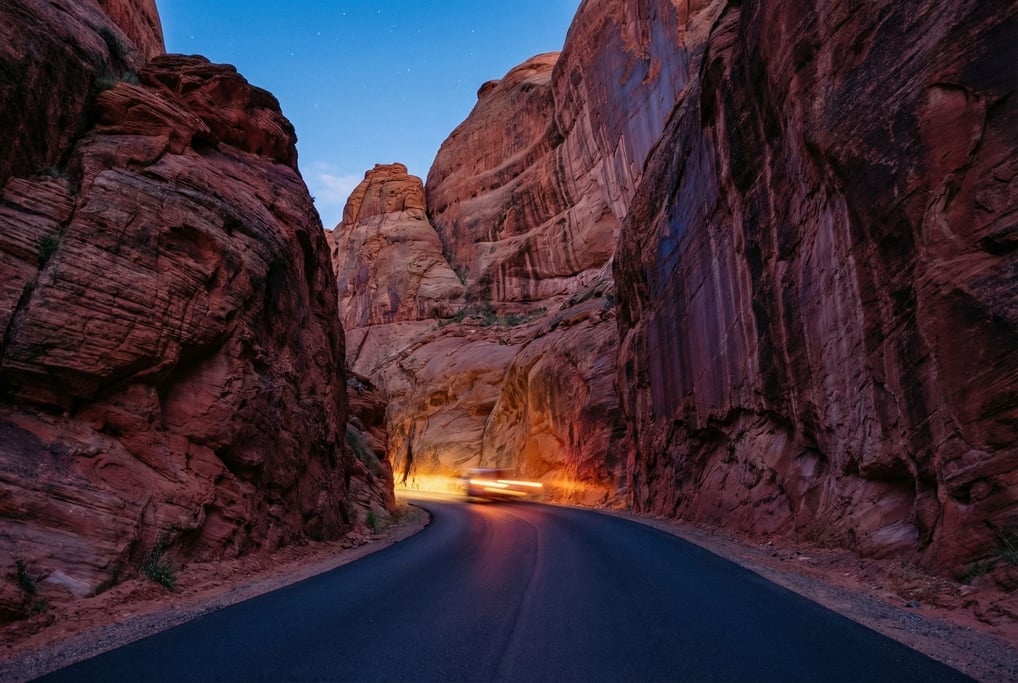 A narrow road winding through red-rock canyons