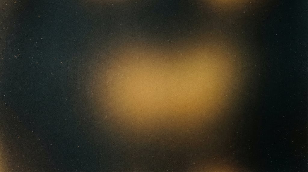 Moody film grain gradient, charcoal background with a diffused pool of warm amber gold at the center