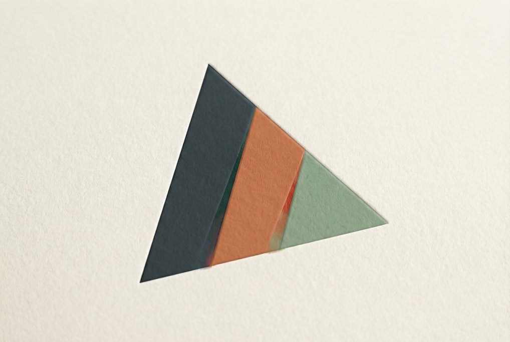 An abstract mountain peak brand mark rendered as three overlapping triangular forms in graduated heights