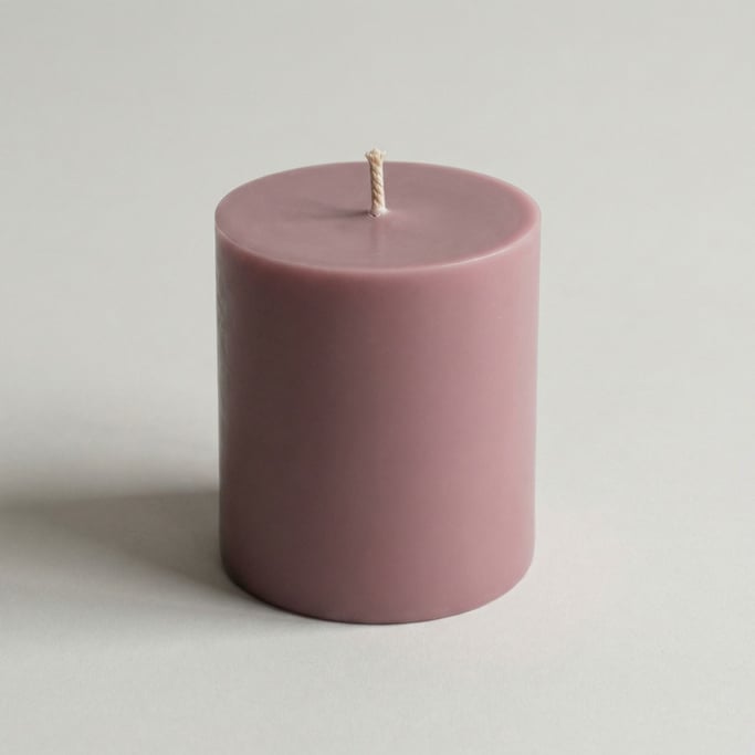 Soy wax pillar candle in dusty mauve with a natural cotton braided wick and smooth hand-poured surfa