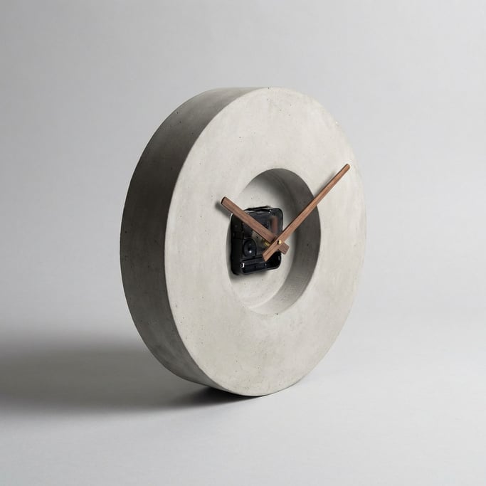 Minimalist concrete wall clock with walnut wood hands, no numerals