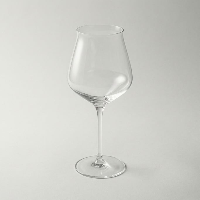 Crystal wine glass with a long elegant pulled stem, paper-thin rim