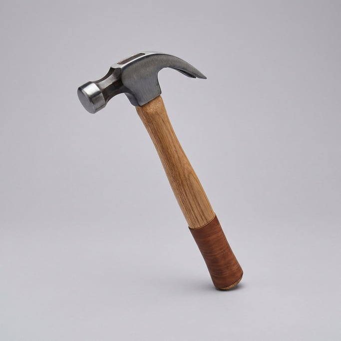 Claw hammer with a natural hickory wood handle, polished forged steel head