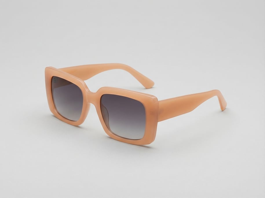 Oversized rectangular sunglasses in opaque matte peach acetate with thick temple arms and gradient s