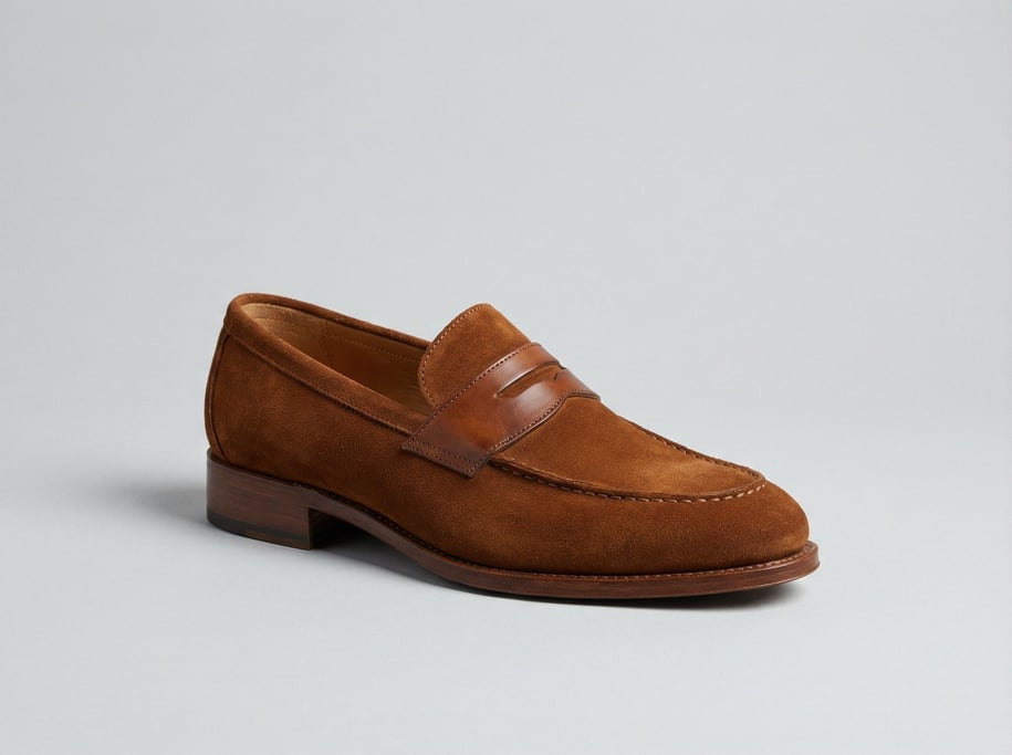 Suede loafer in rich tobacco brown with a leather stacked heel, hand-stitched apron