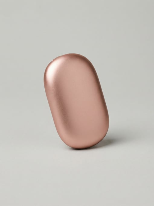 Rechargeable hand warmer in rose gold anodized aluminum with a smooth pebble-shaped ergonomic body a