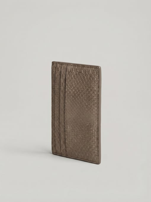Embossed snakeskin-textured leather card holder in muted taupe with four card slots and a slim profi