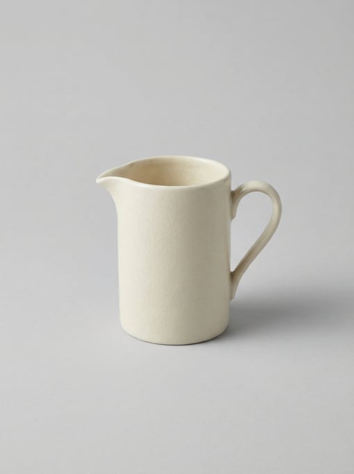 Ceramic sake pitcher in crackle-glaze ivory with a minimalist side-pour spout and a petite single fi