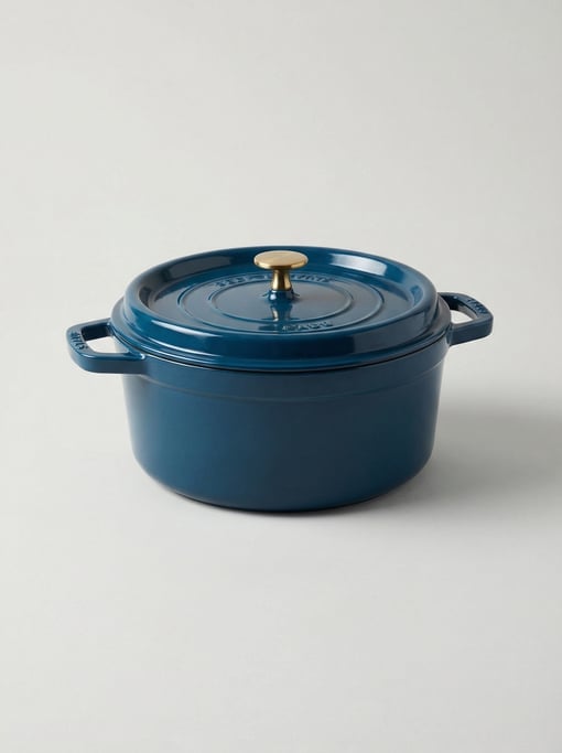 Enameled cast iron Dutch oven in deep ocean blue with a self-basting lid and a polished brass knob h