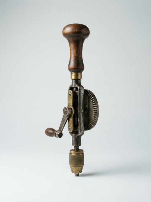 Vintage hand drill with a mushroom-shaped wooden handle, brass three-jaw chuck
