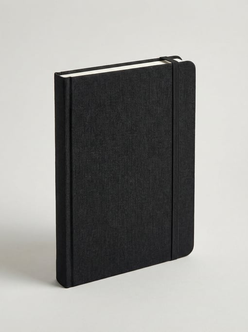 Hardbound artist sketchbook with a black linen cloth cover, rounded corners