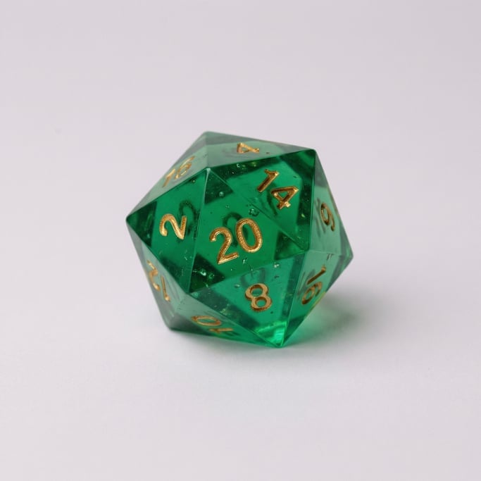 Polyhedral twenty-sided die in translucent emerald green resin with gold metallic ink numbering and