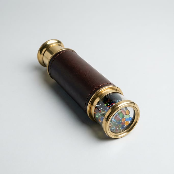 Brass kaleidoscope tube with a rotating glass bead chamber at the end, leather-wrapped body