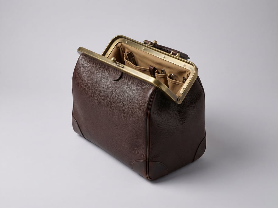 Leather medical bag in dark brown pebbled cowhide with a brass spring-frame clasp