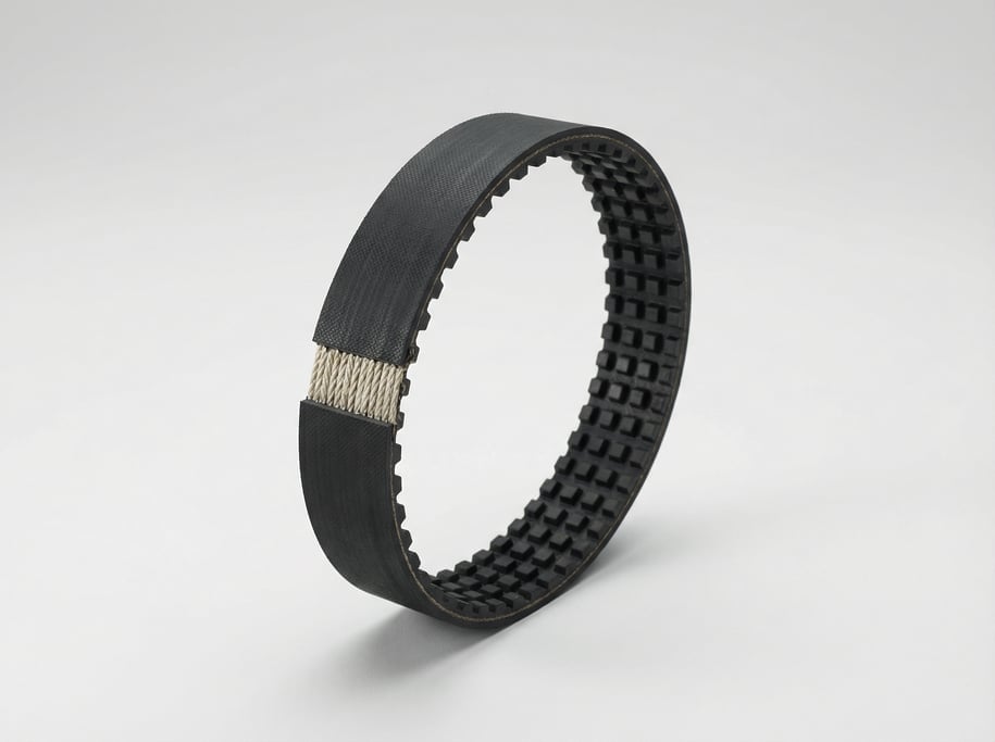 Rubber timing belt in black reinforced neoprene with visible internal fiber cords and precisely spac