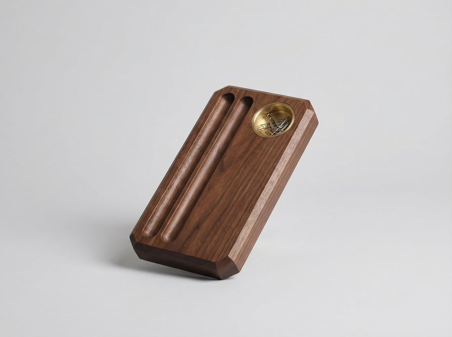 Walnut desk pen tray with two grooved channels, a brass-lined well for paper clips