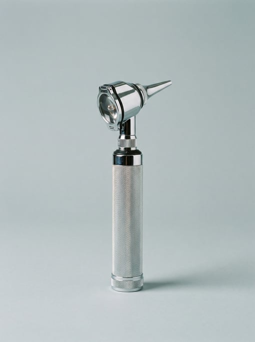 Chrome otoscope with a tapered examination tip, magnifying lens head, halogen light