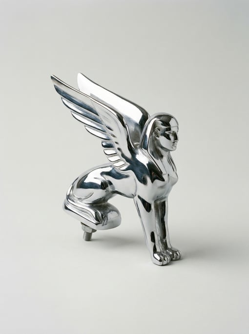 Vintage chrome hood ornament in an art deco winged figure design with a polished mirror finish and a