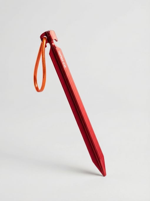 Anodized aluminum tent stake in bright red with a Y-beam profile, reflective guy-line loop