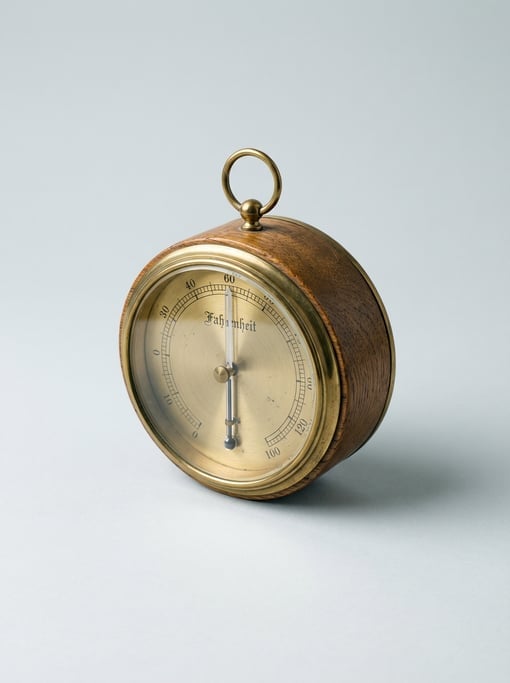 Vintage brass thermometer in a turned wooden case with an etched Fahrenheit scale, mercury column
