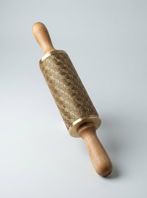 Brass metal clay texture roller with a geometric pattern engraved on the cylinder, wooden handles