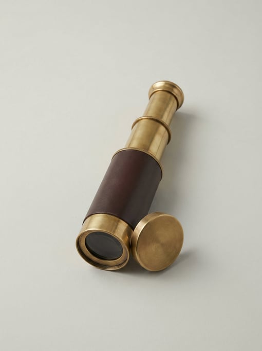 Folding pocket telescope in polished brass with three extending draw tubes, a leather barrel wrap