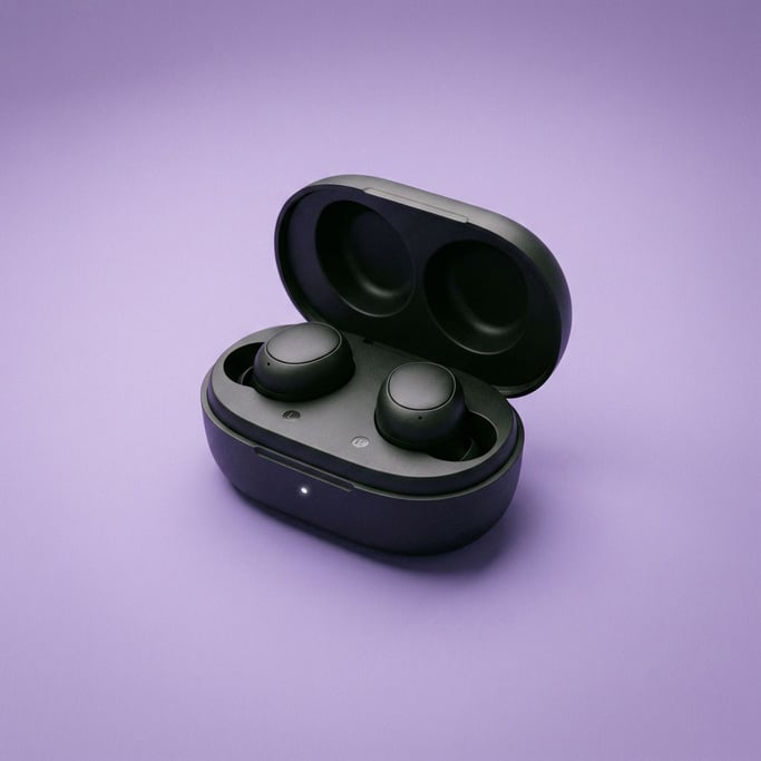 Noise-canceling earbuds in their open matte black charging case, soft diffused overhead light