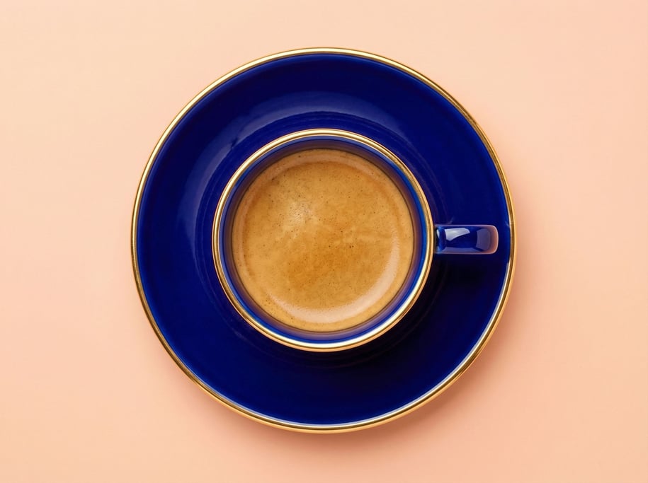 Espresso cup and saucer in glossy cobalt blue porcelain with a gold rim