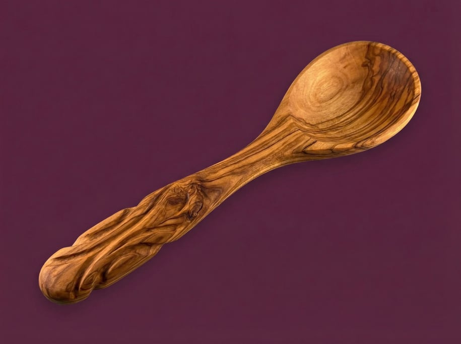 Olivewood salad serving spoon with a hand-carved handle and visible grain