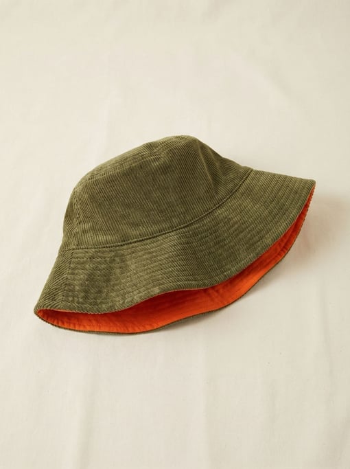 Corduroy bucket hat in olive green with a contrasting orange inner brim