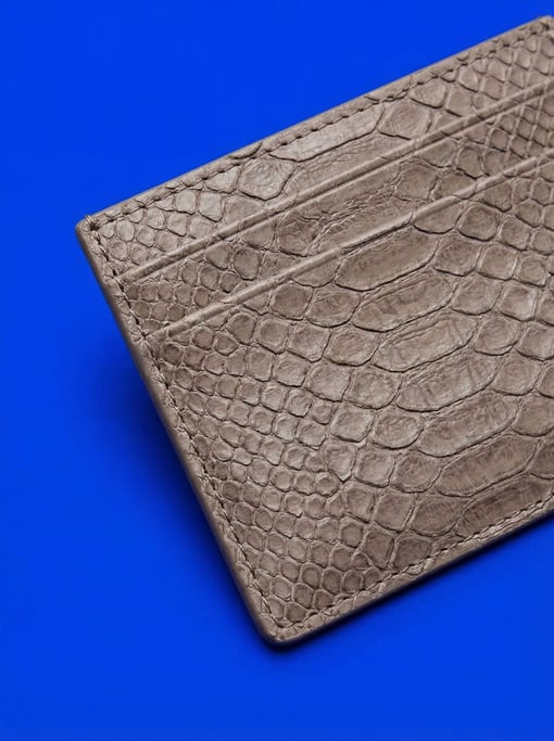 Snakeskin-textured leather card holder in muted taupe