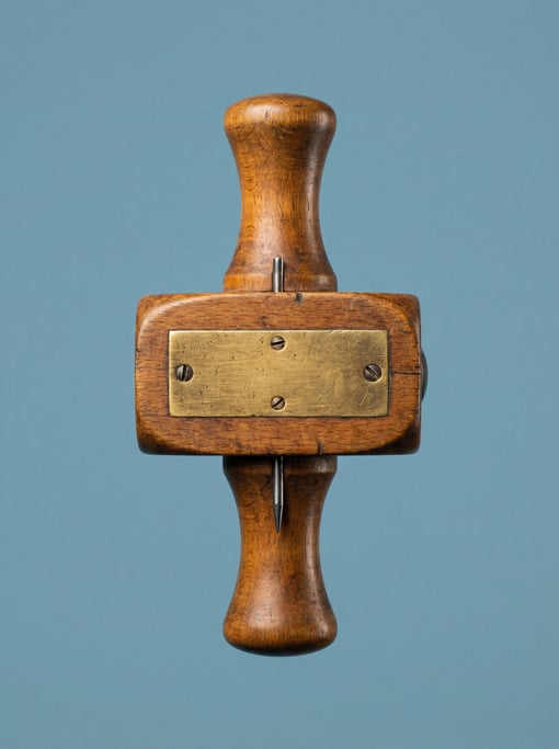 Woodworking marking gauge in beech with a brass wear plate, studio macro lighting