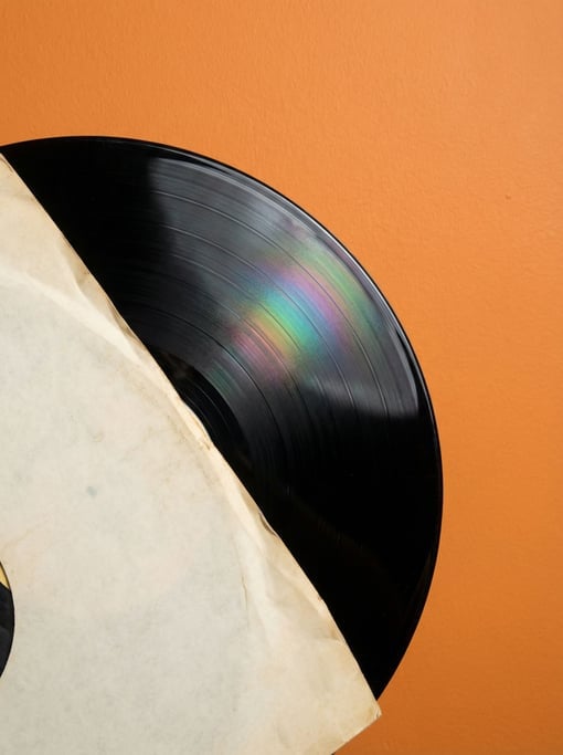 Vinyl record in its inner sleeve, partially visible showing the grooved black surface