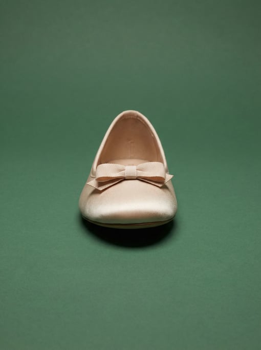 Satin ballet flat in pale champagne with a delicate grosgrain bow