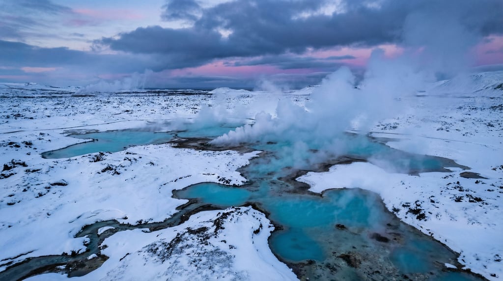 Snow-covered volcanic hot springs, steam rising from turquoise mineral pools into sub-zero air