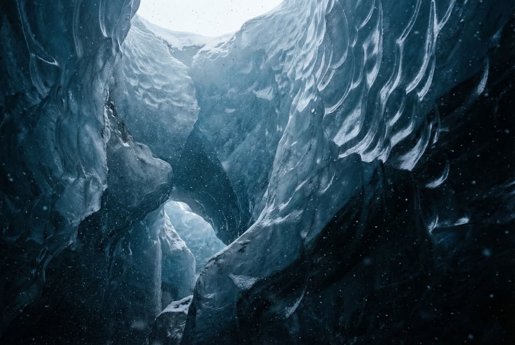 Ice cave interior, translucent blue walls with sunlight filtering through from above