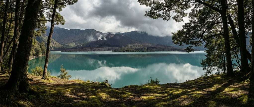 A volcanic caldera lake, perfectly still turquoise water surrounded by dark ash-covered slopes and w (jm3bpwvs)