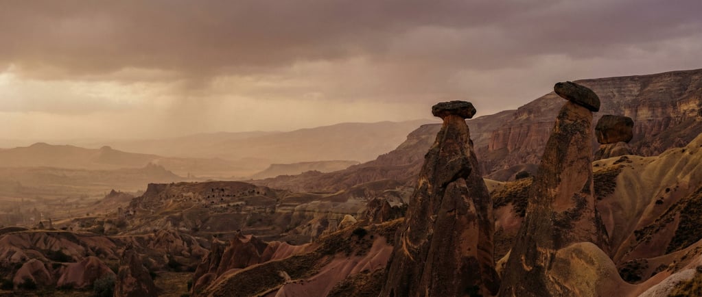 Fairy chimneys in Cappadocia, erosion-carved stone towers with balanced cap rocks (wvy27b)