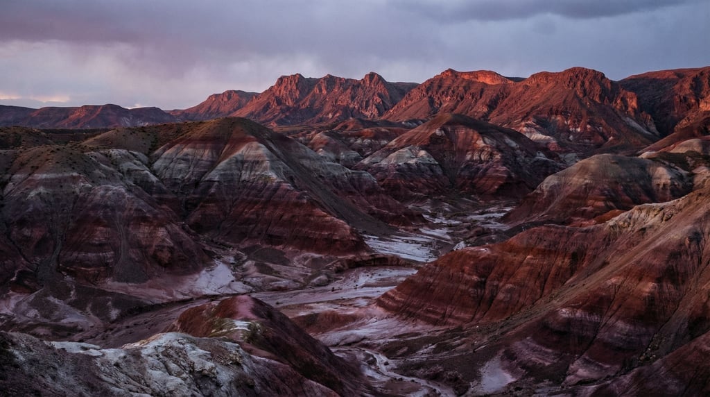 Painted desert hills in bands of red, purple, gray, and white (aeyeqmbp)