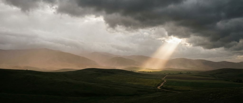 Rolling green hills under a dramatic stormy sky (3de9lzll)