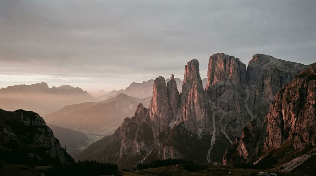 Dolomite towers glowing pink in alpenglow, vertical limestone pillars against a deep twilight sky (jd0avbg3)