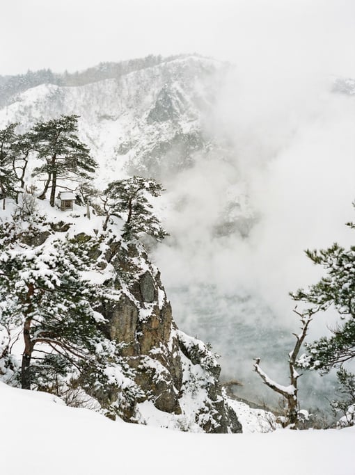 A snow-covered volcanic crater rim in Japan