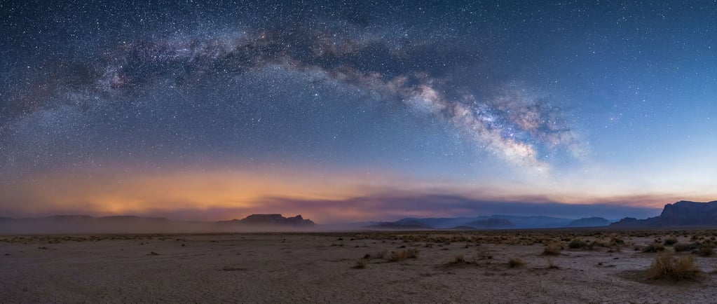 Milky Way arching over a flat desert landscape, stars sharp and countless, no light pollution (dalf9uky)