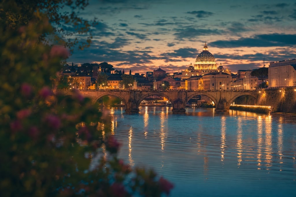 Glowing cityscape at twilight with reflections dancing on a shimmering river