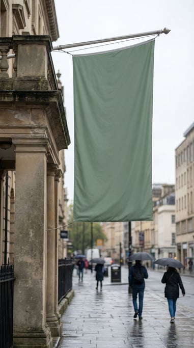 Tall vertical banner flag on a pole on a stone column