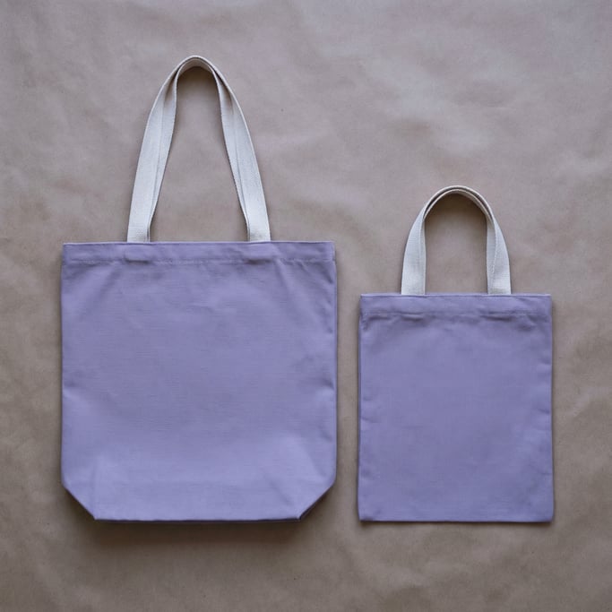 Canvas tote bag in matte lavender, two bags side by side different sizes