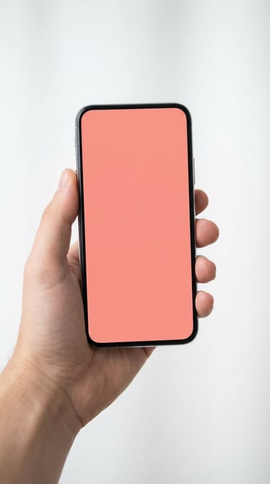 Hand holding a smartphone against a clean white studio background