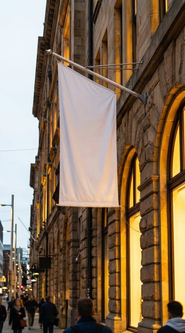 Tall vertical banner flag on a pole on a sandstone building exterior