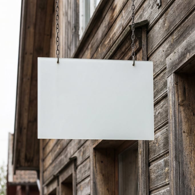 Rectangular hanging sign attached to a wooden building facade
