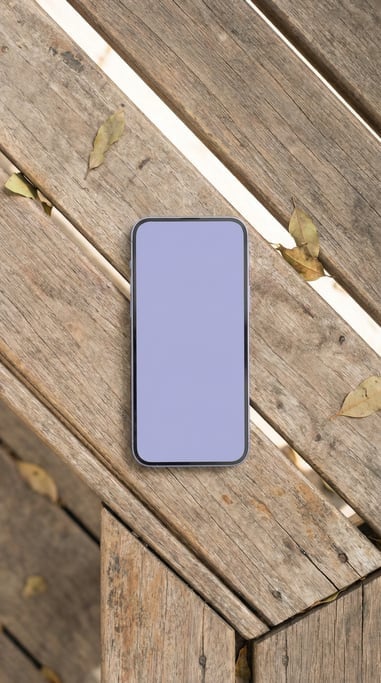 Smartphone face down showing back on a wooden bench